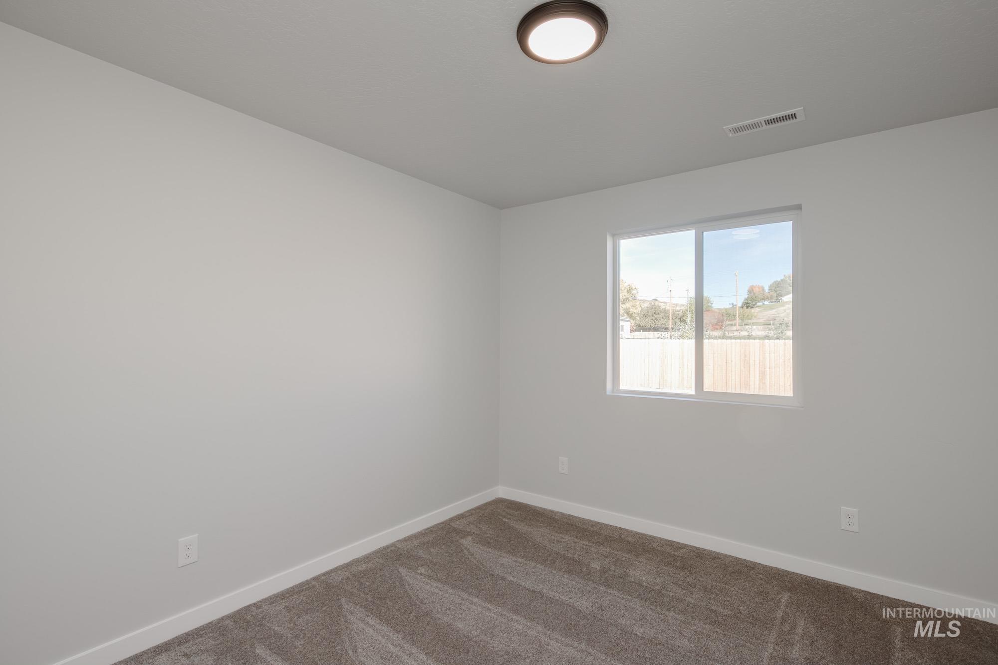 1732 Webb Brk Street Middleton, ID 83644 - Photo 16 of 29 Carpeted empty room featuring baseboards