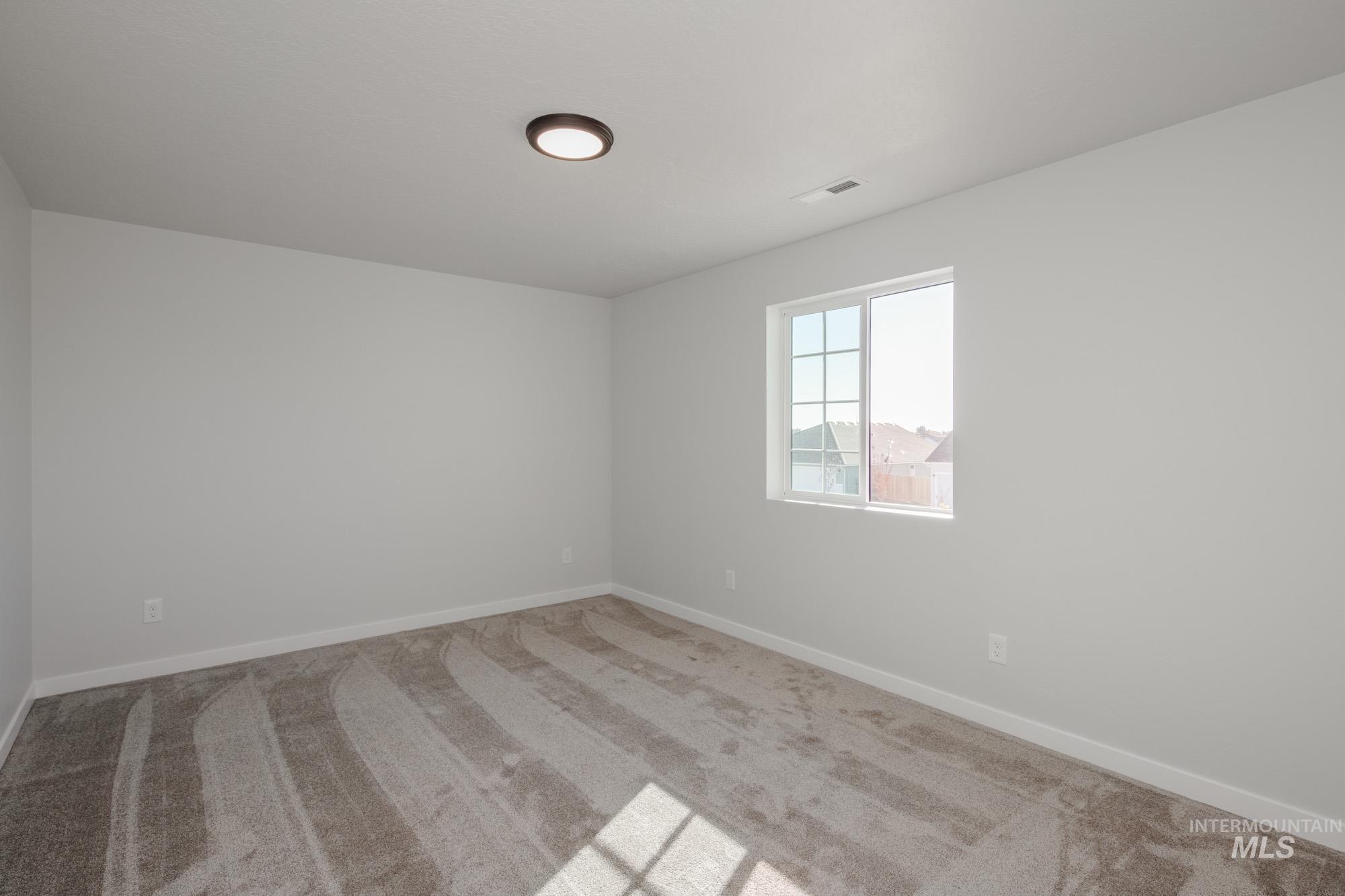 1732 Webb Brk Street Middleton, ID 83644 - Photo 19 of 29 Unfurnished room featuring carpet flooring and baseboards