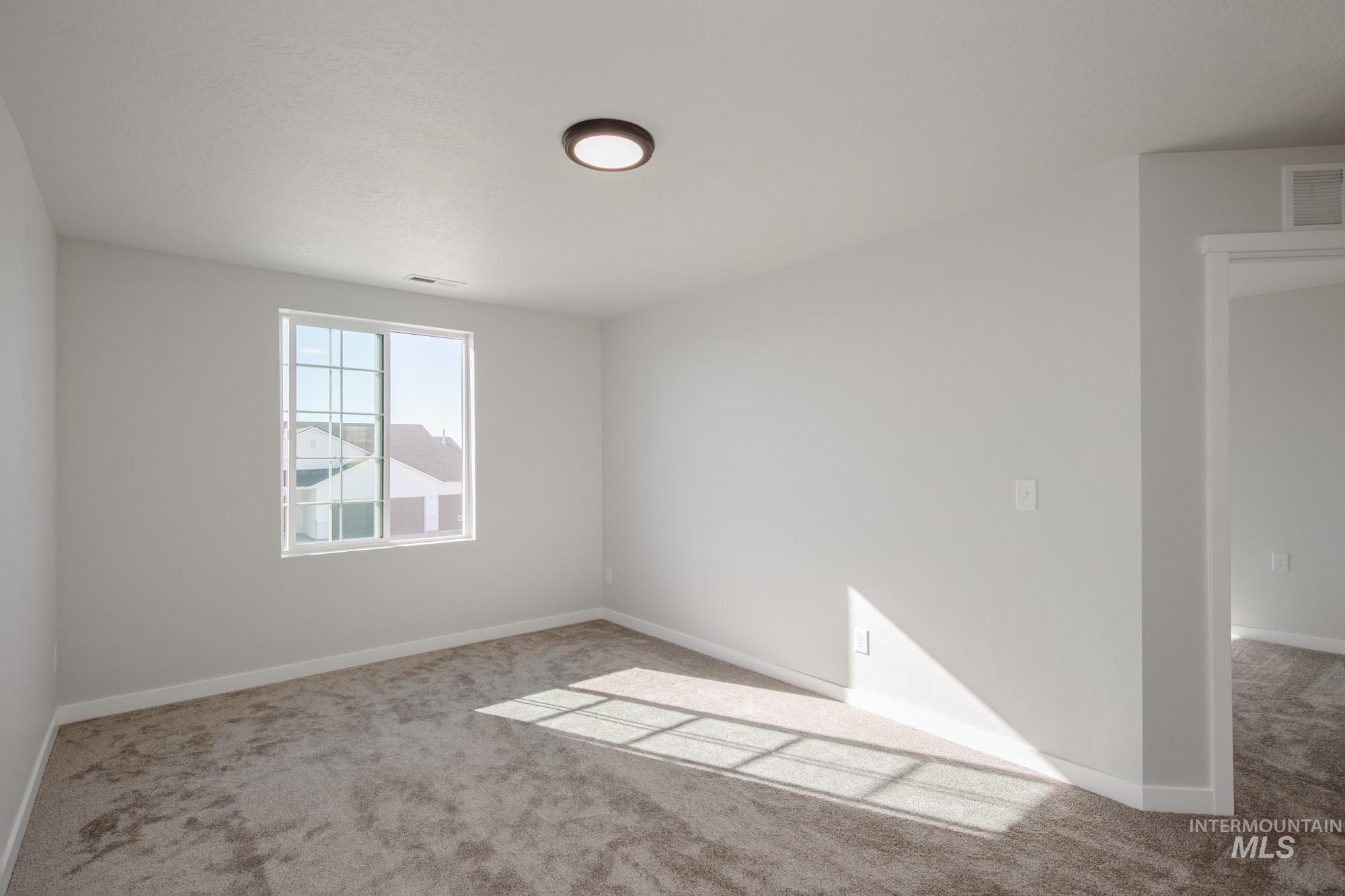 1732 Webb Brk Street Middleton, ID 83644 - Photo 20 of 29 Unfurnished room featuring carpet flooring