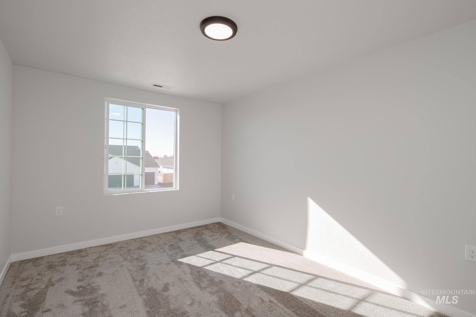 1732 Webb Brk Street Middleton, ID 83644 - Photo 21 of 29 Carpeted spare room featuring baseboards