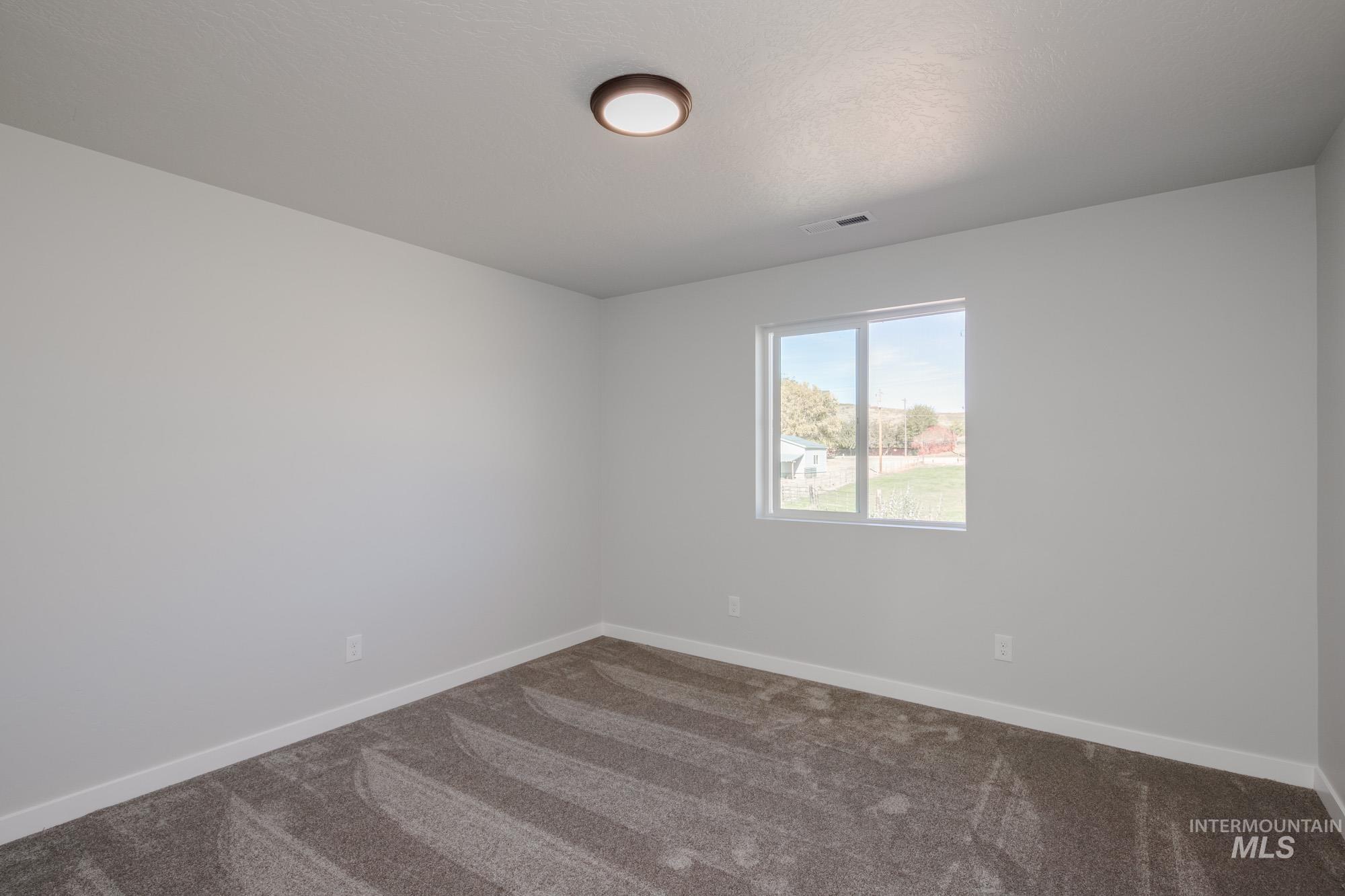 1732 Webb Brk Street Middleton, ID 83644 - Photo 23 of 29 Carpeted spare room with baseboards