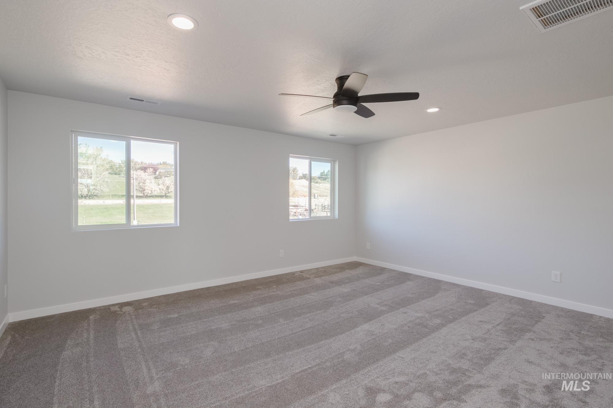 1732 Webb Brk Street Middleton, ID 83644 - Photo 24 of 29 Carpeted spare room with ceiling fan and recessed lighting