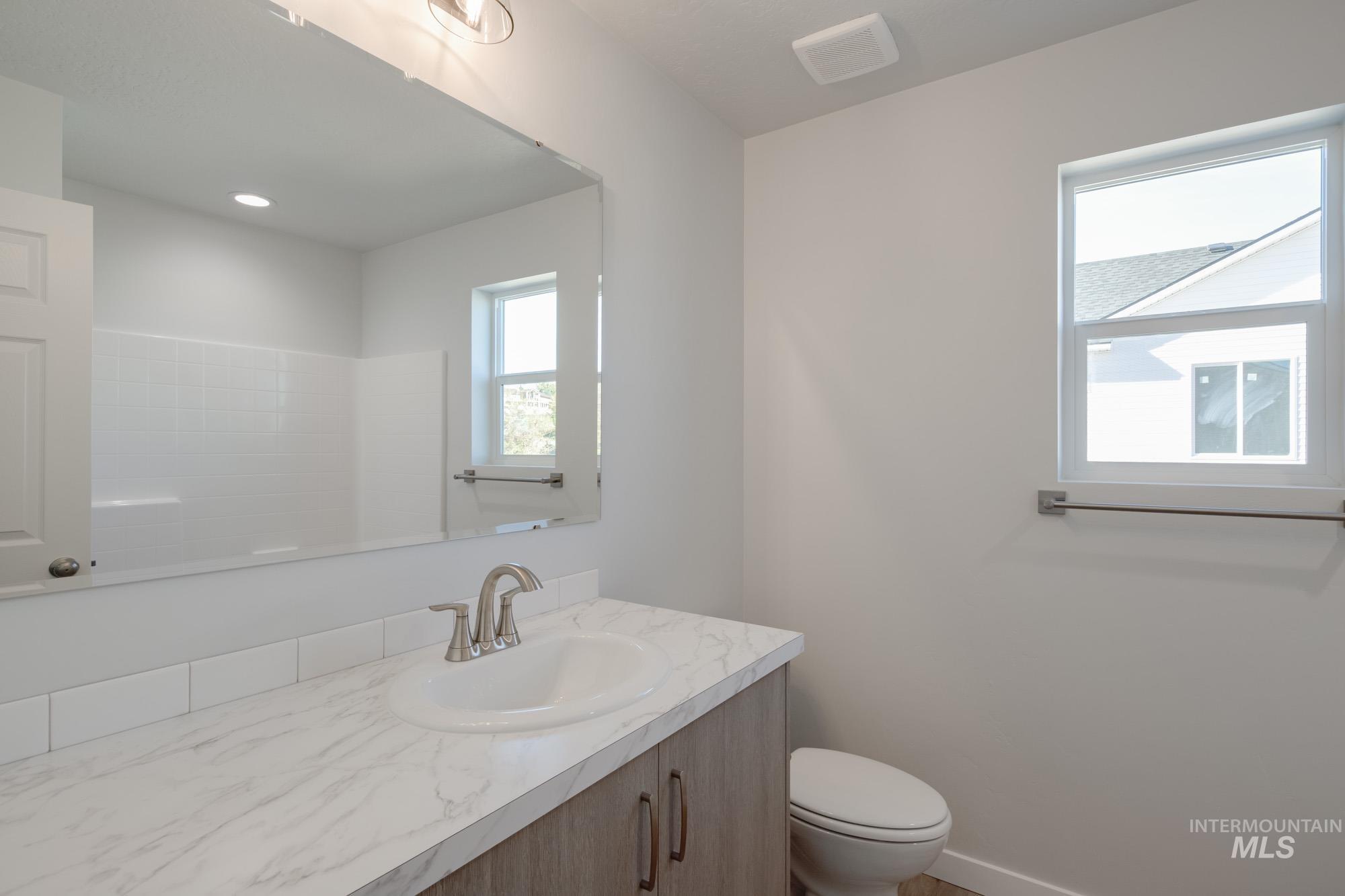1732 Webb Brk Street Middleton, ID 83644 - Photo 28 of 29 Bathroom featuring vanity and toilet