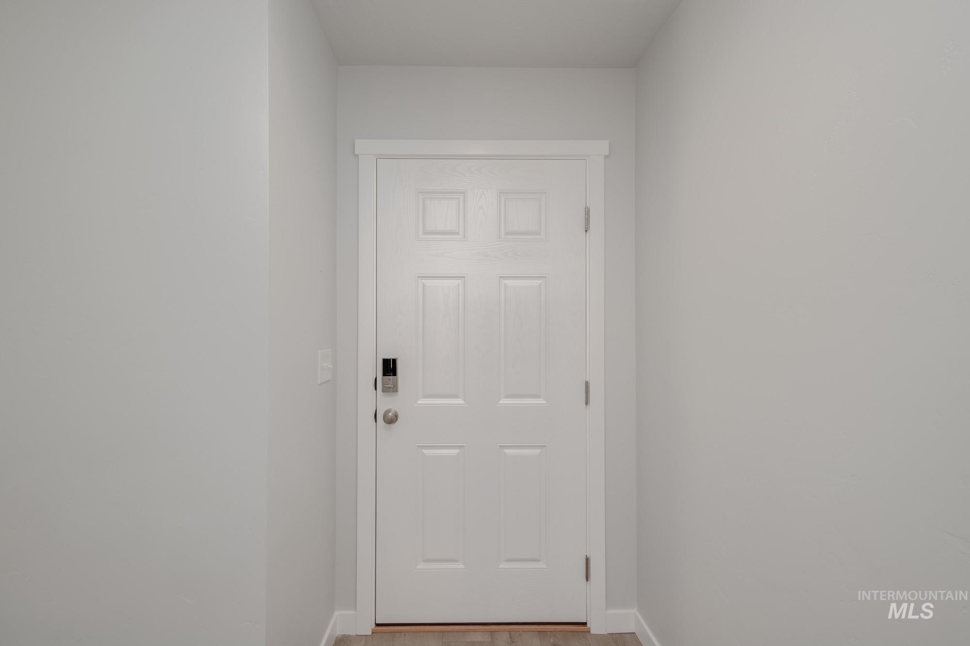 1732 Webb Brk Street Middleton, ID 83644 - Photo 3 of 29 Doorway with baseboards and wood finished floors