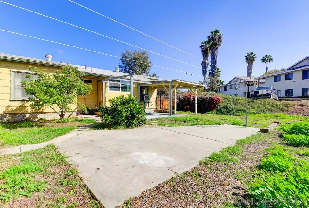 8941 Switzer Drive Spring Valley, CA 91977 - Photo 21 of 23 a front view of a house with a garden and yard