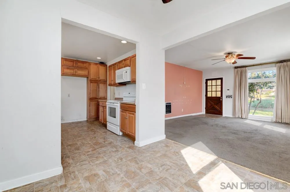 8941 Switzer Drive Spring Valley, CA 91977 - Photo 4 of 23 a view of a kitchen with a sink and a refrigerator