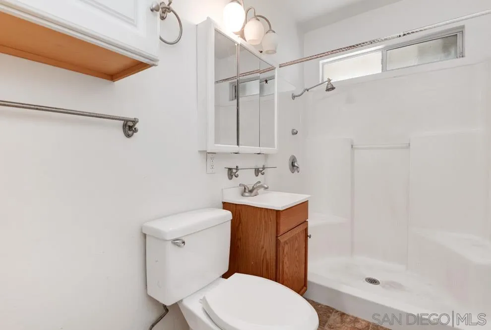 8941 Switzer Drive Spring Valley, CA 91977 - Photo 7 of 23 a bathroom with a sink a toilet and shower