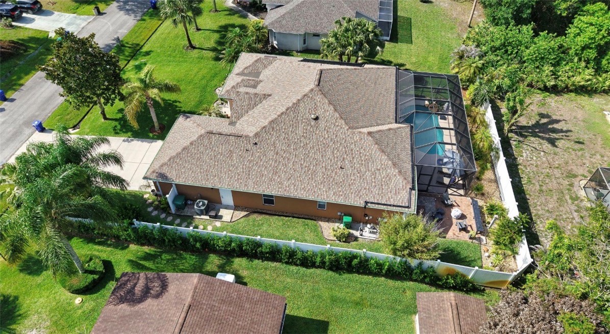 1771 Mistletoe Street Sebastian, FL 32958 - Photo 34 of 36 an aerial view of a house with a yard and garden