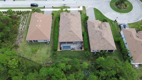 a street sign on a sidewalk next to a road