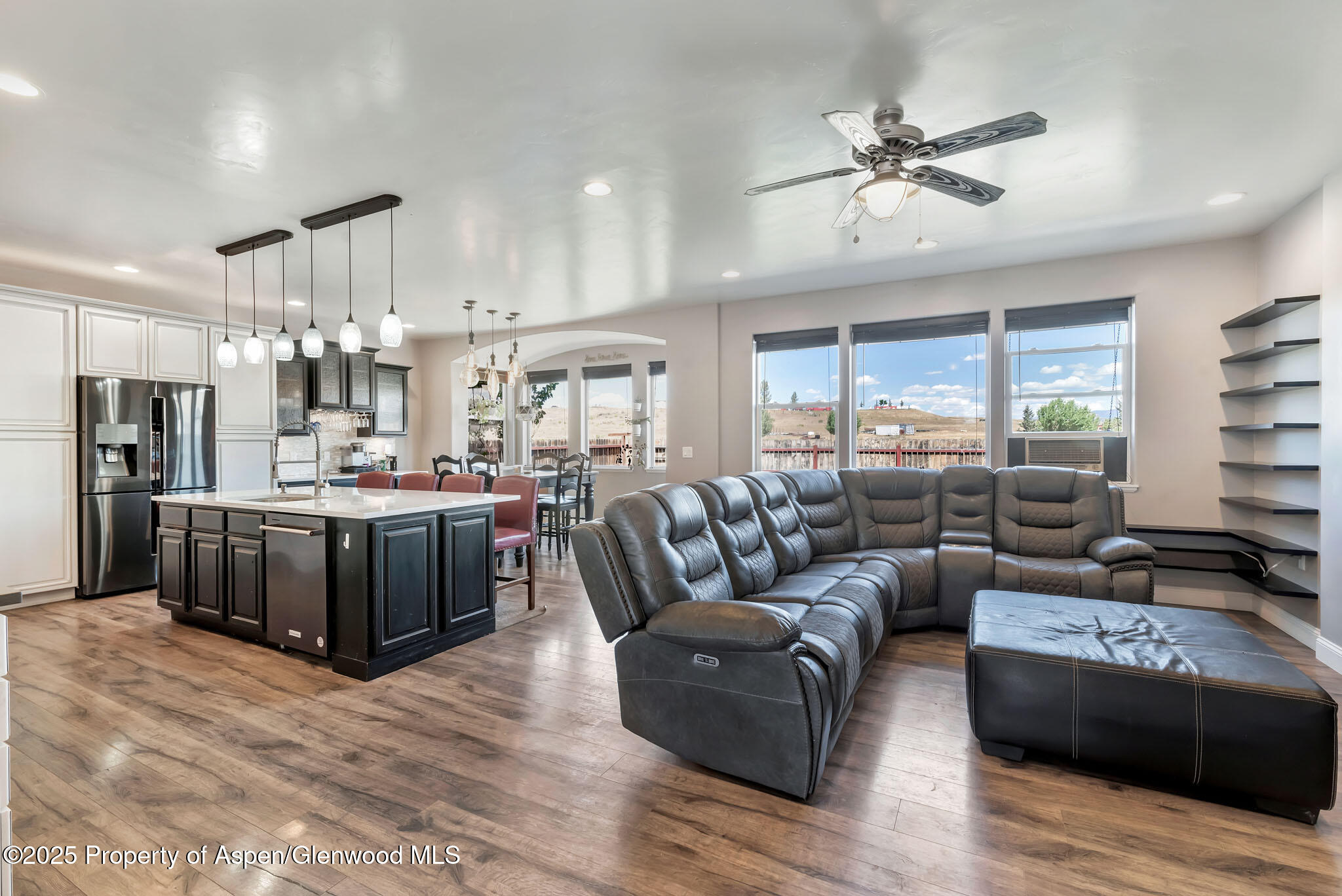 875 Dry Creek Road Hayden, CO 81639 - Photo 4 of 40 a living room with furniture kitchen and a chandelier