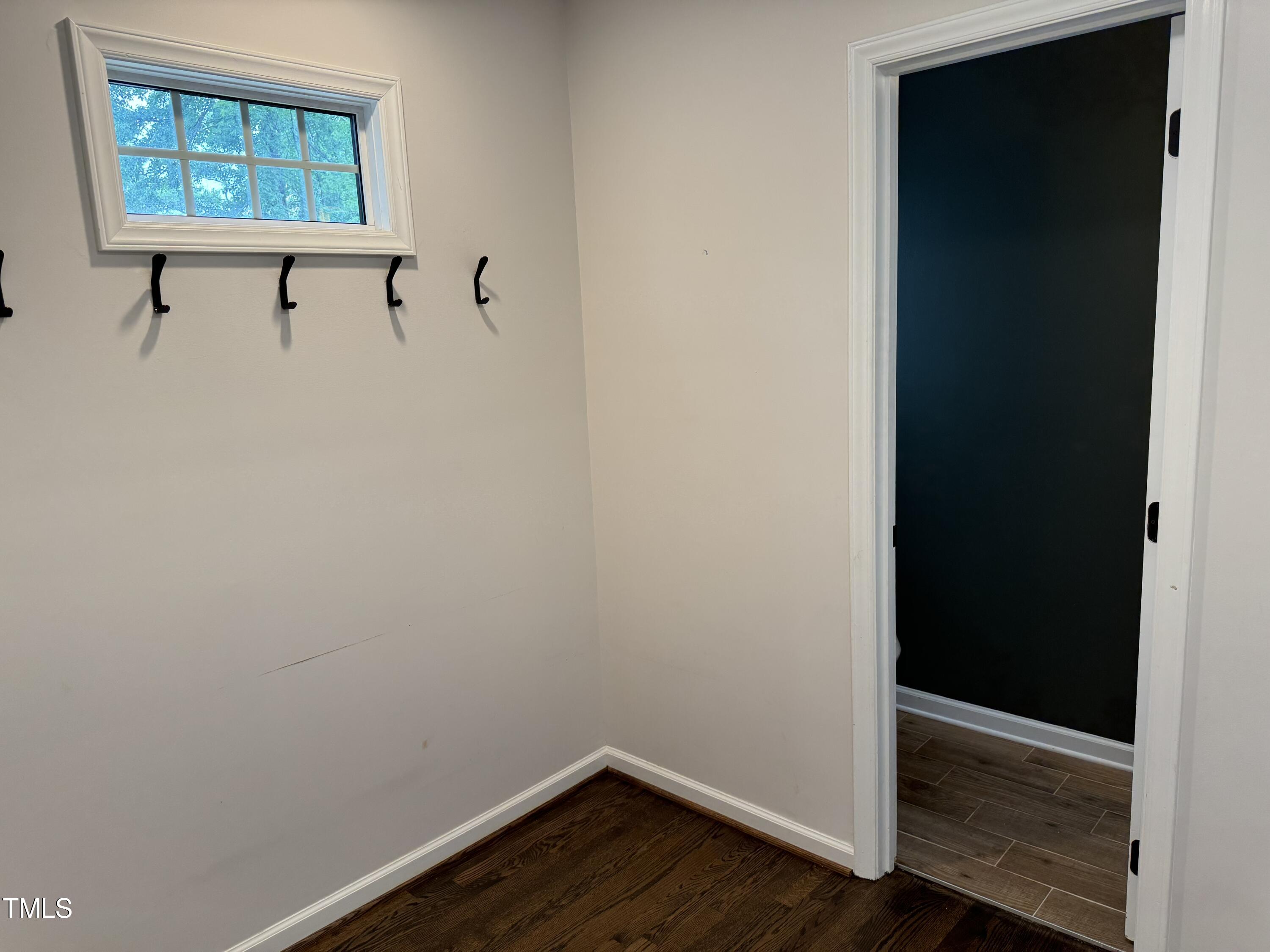 2501 Ferguson Road Raleigh, NC 27612 - Photo 11 of 30 a view of a small space with wooden floor and windows
