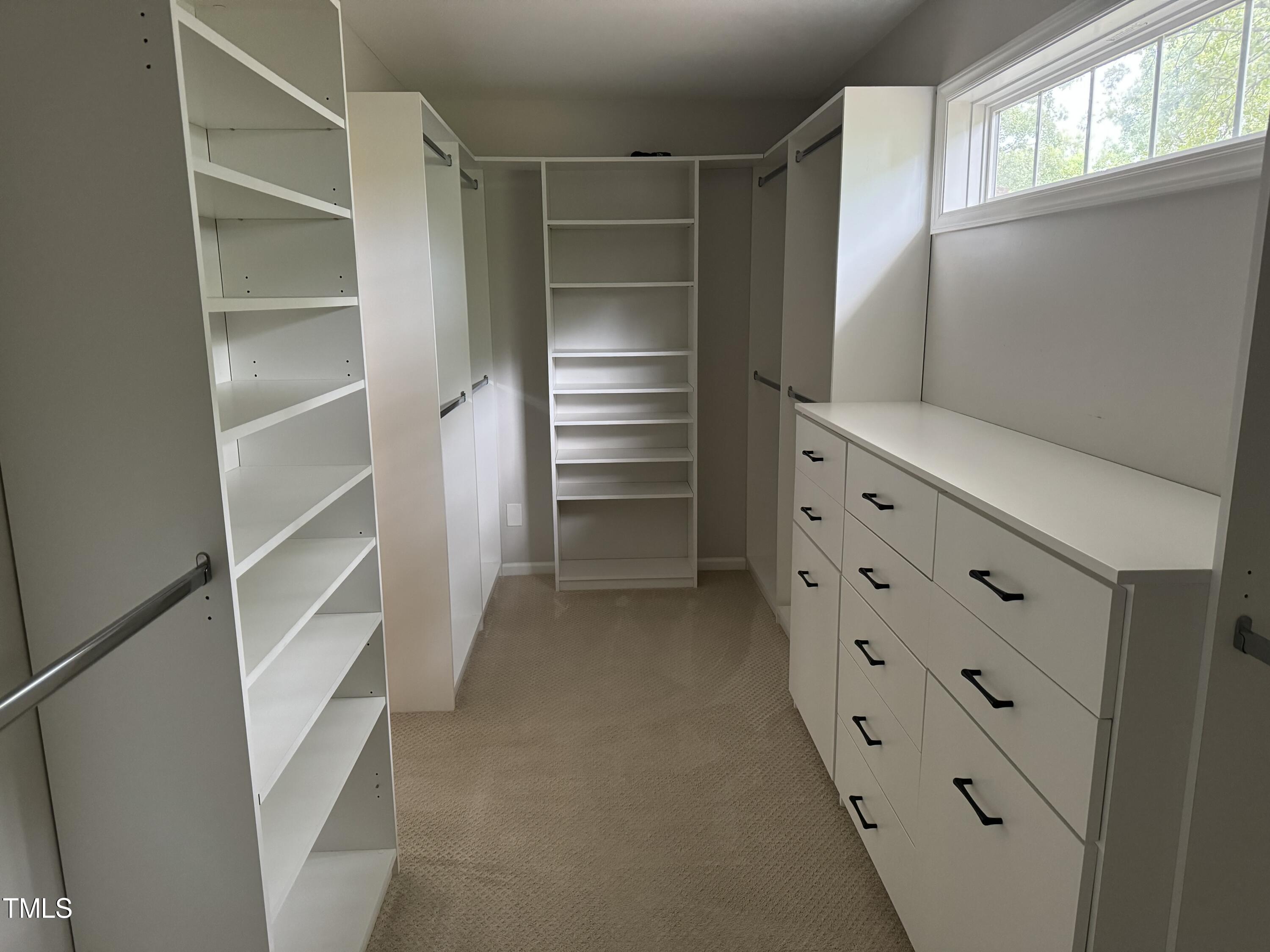 2501 Ferguson Road Raleigh, NC 27612 - Photo 15 of 30 a view of walk in closet with empty racks