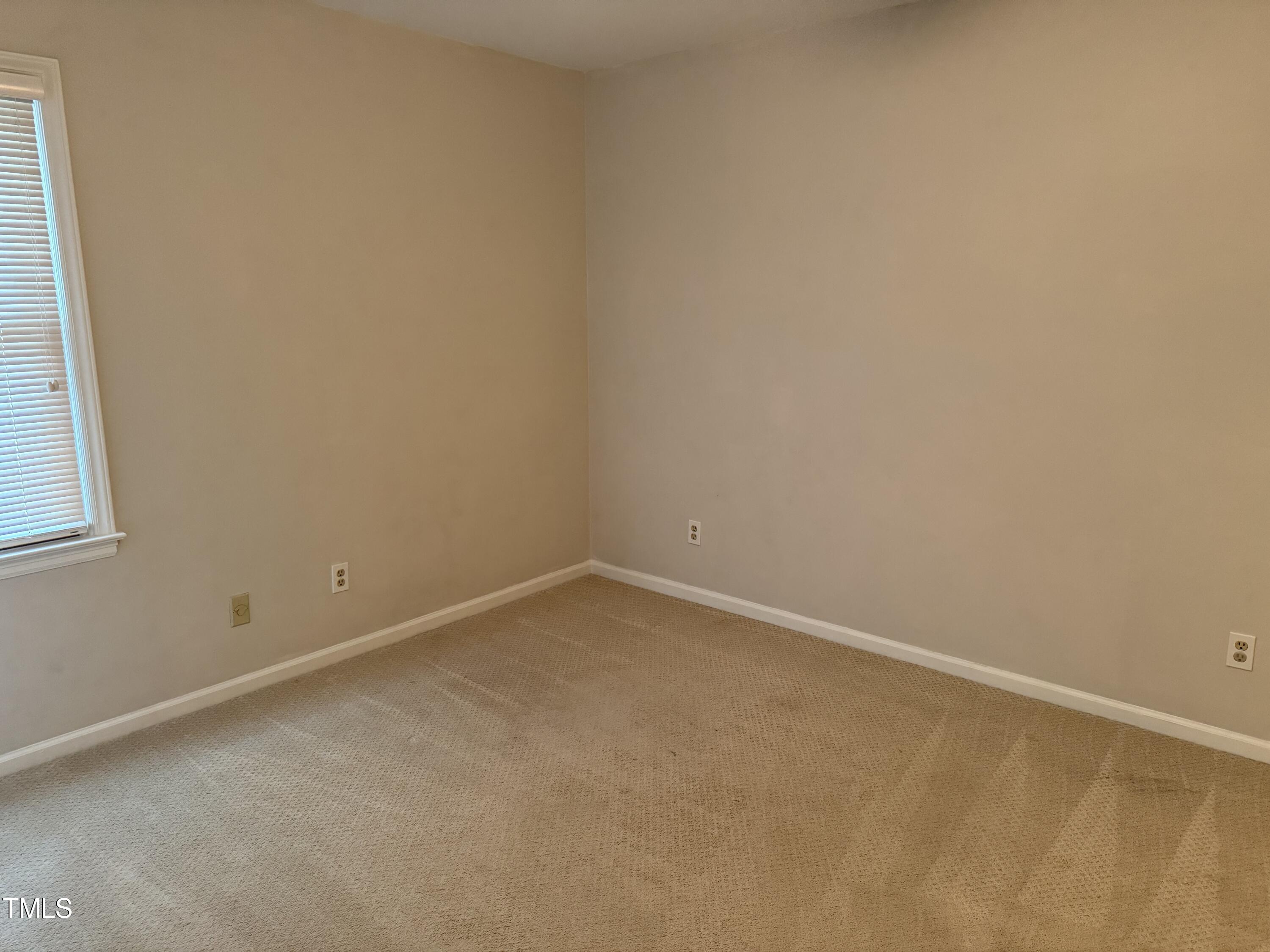 2501 Ferguson Road Raleigh, NC 27612 - Photo 16 of 30 an empty room with a window