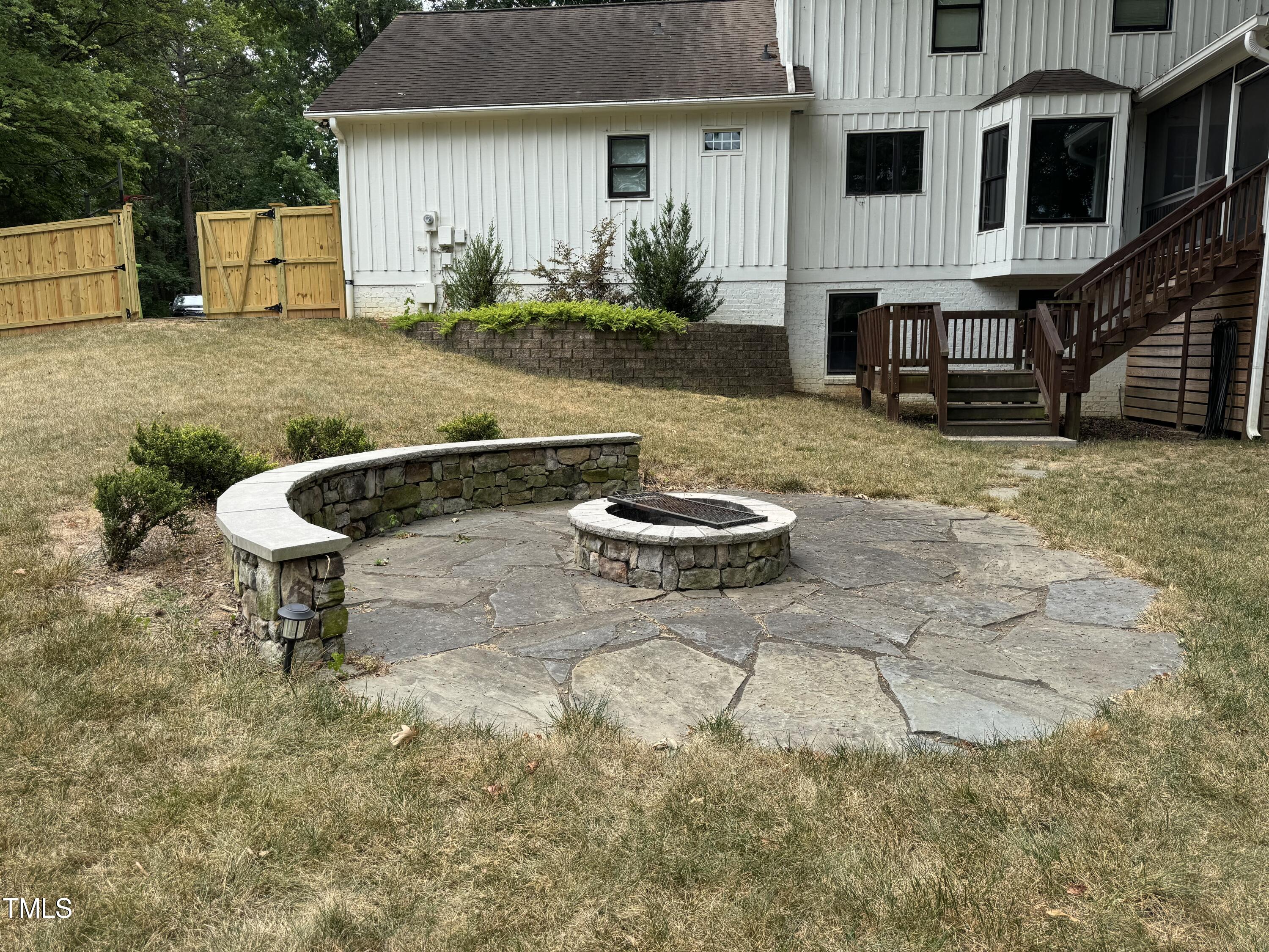 2501 Ferguson Road Raleigh, NC 27612 - Photo 22 of 30 a backyard of a house with yard and fountain