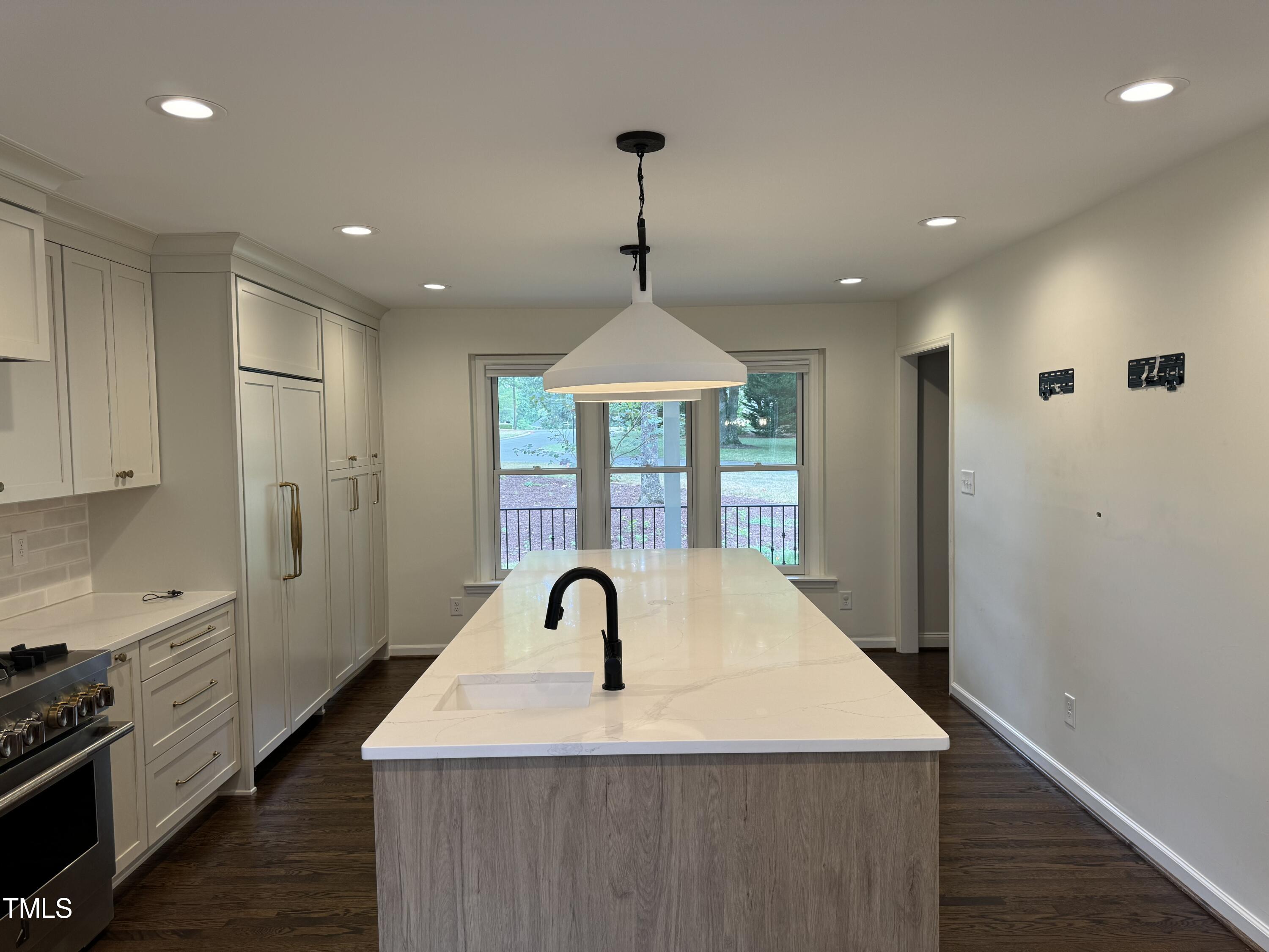 2501 Ferguson Road Raleigh, NC 27612 - Photo 10 of 30 a very nice looking kitchen with a large window stainless steel appliances and cabinets