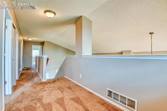 a view of a hallway with closet