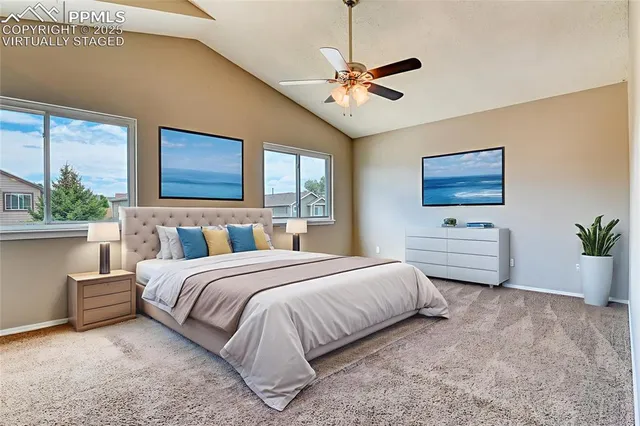 a bedroom with a bed dresser and window