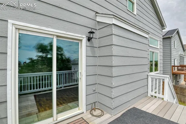 a view of a small house and wooden floor