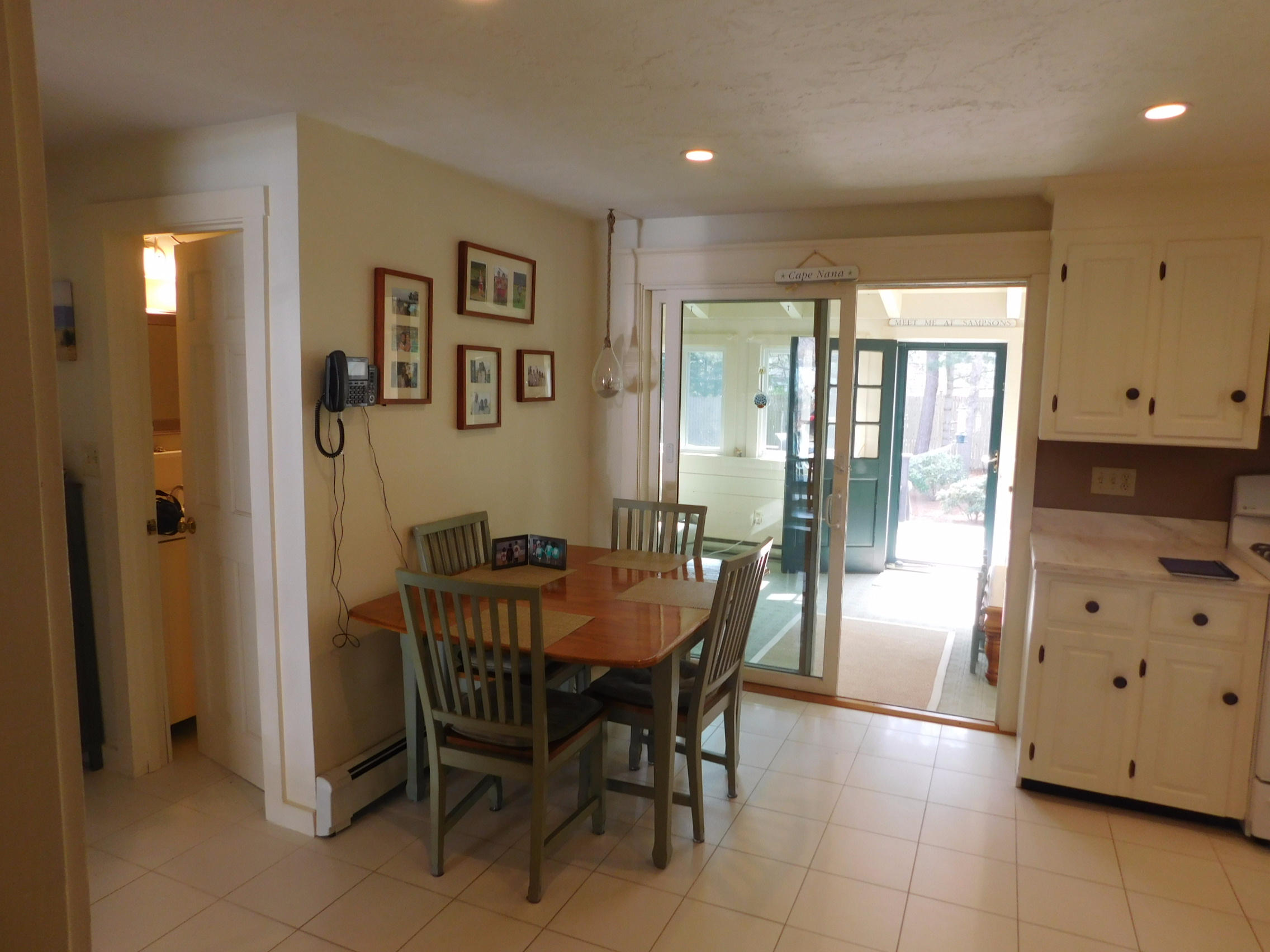 17 Captain Carltons Road Cotuit, MA 02635 - Photo 11 of 26 a view of a dining room with furniture