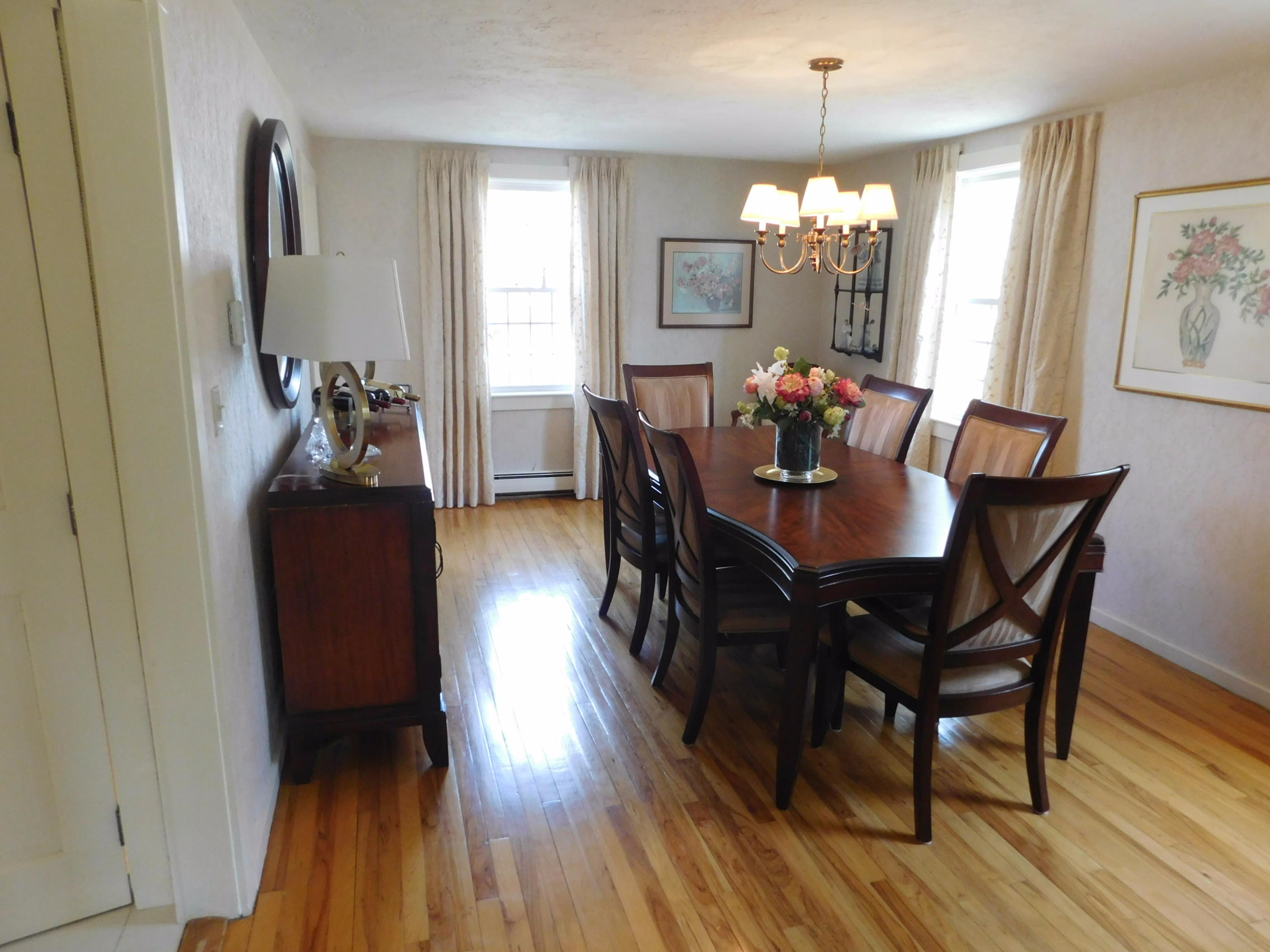 17 Captain Carltons Road Cotuit, MA 02635 - Photo 16 of 26 a view of a dining room with furniture and wooden floor