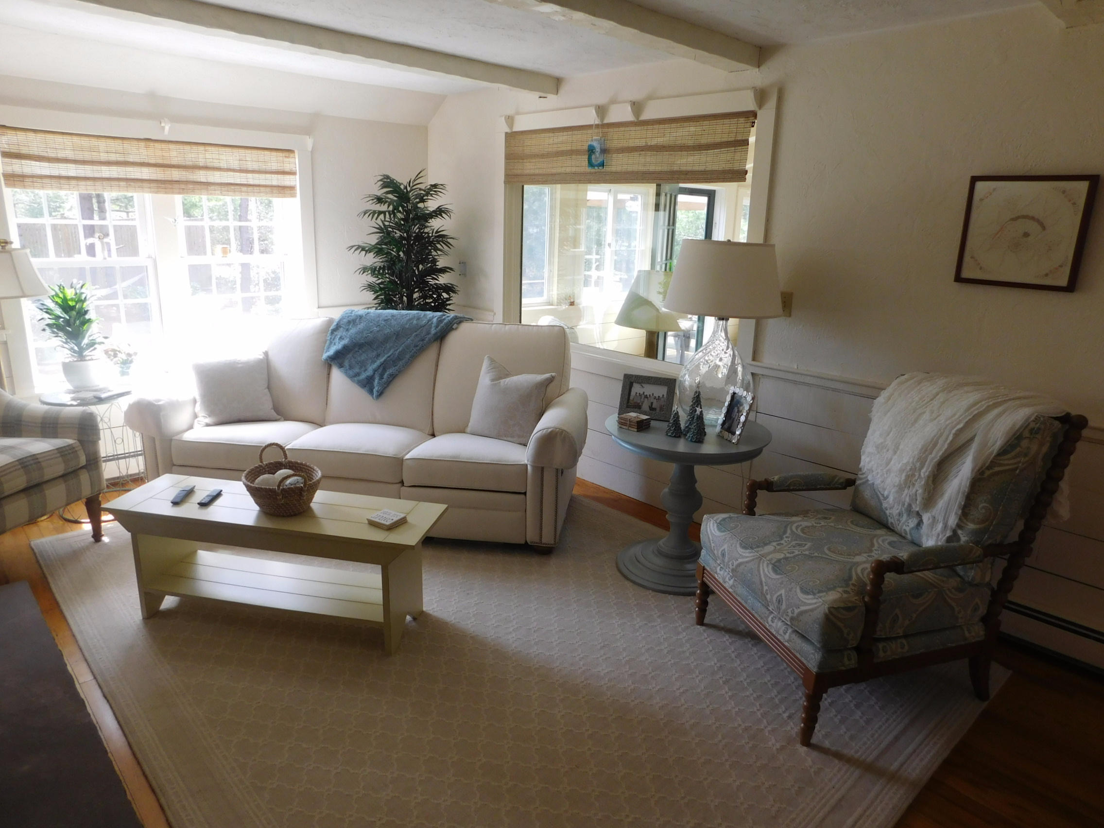 17 Captain Carltons Road Cotuit, MA 02635 - Photo 20 of 26 a living room with furniture and a large window