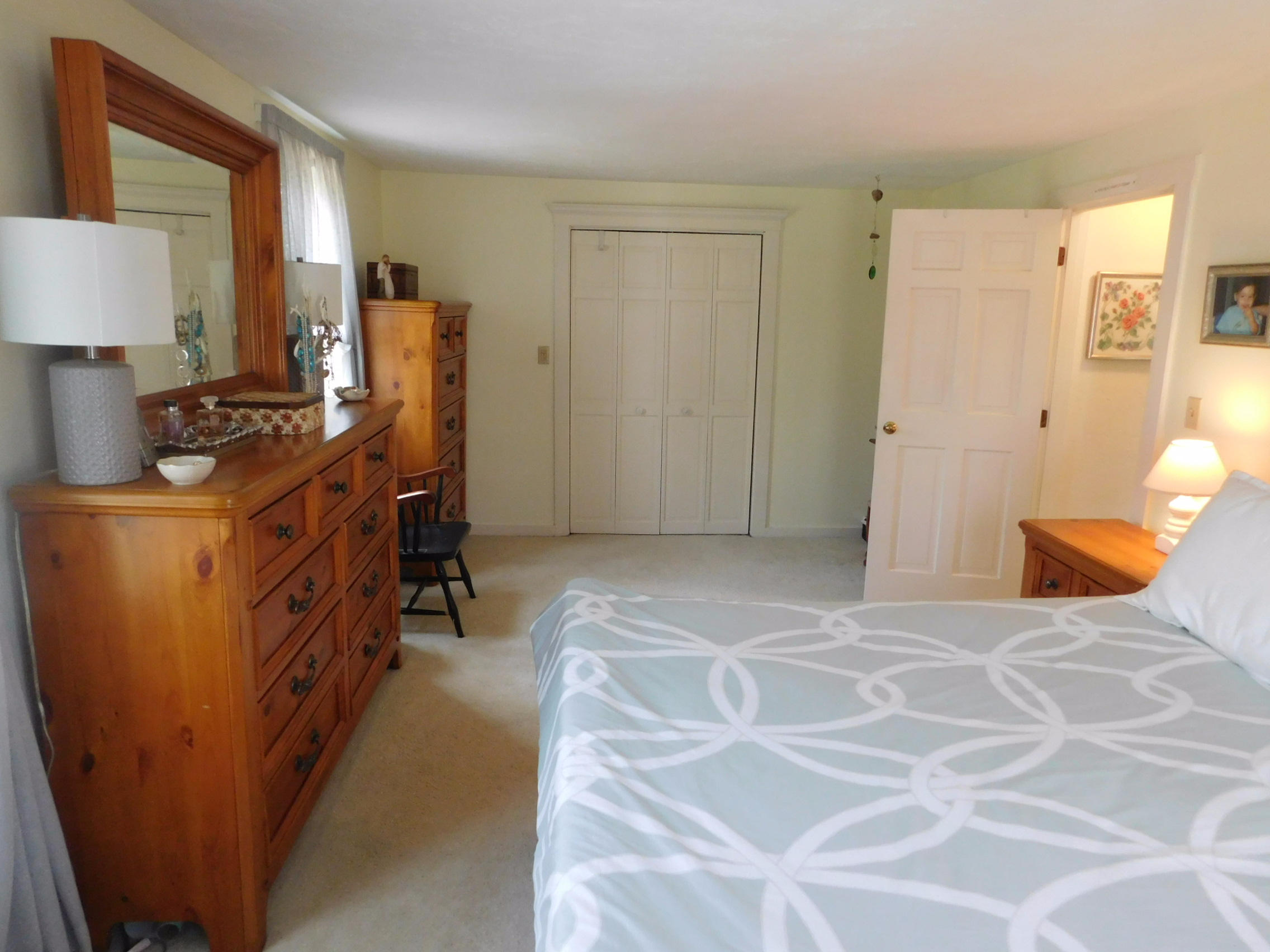17 Captain Carltons Road Cotuit, MA 02635 - Photo 21 of 26 a bedroom with a bed and furniture
