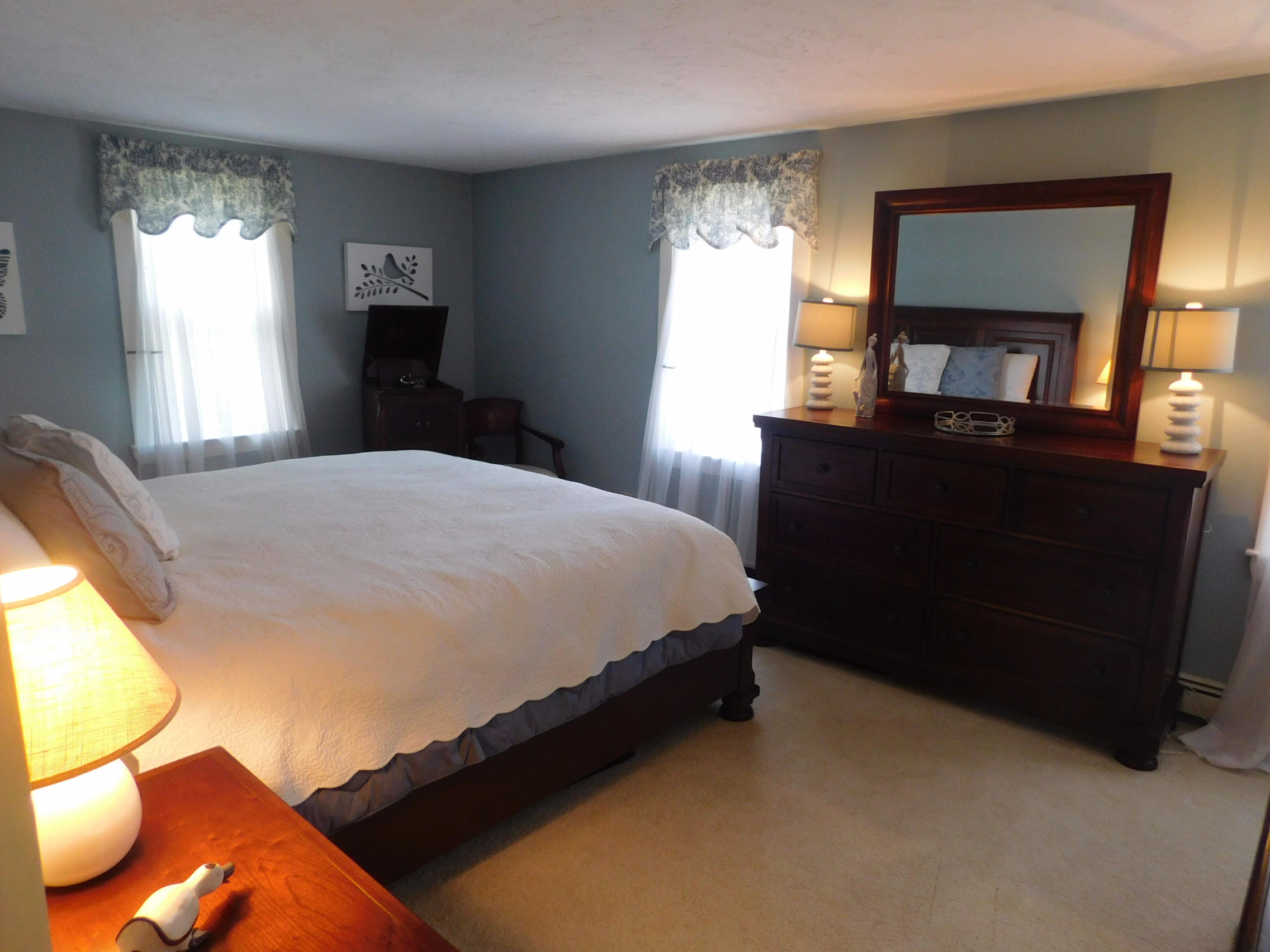 17 Captain Carltons Road Cotuit, MA 02635 - Photo 24 of 26 a bedroom with a bed and a window