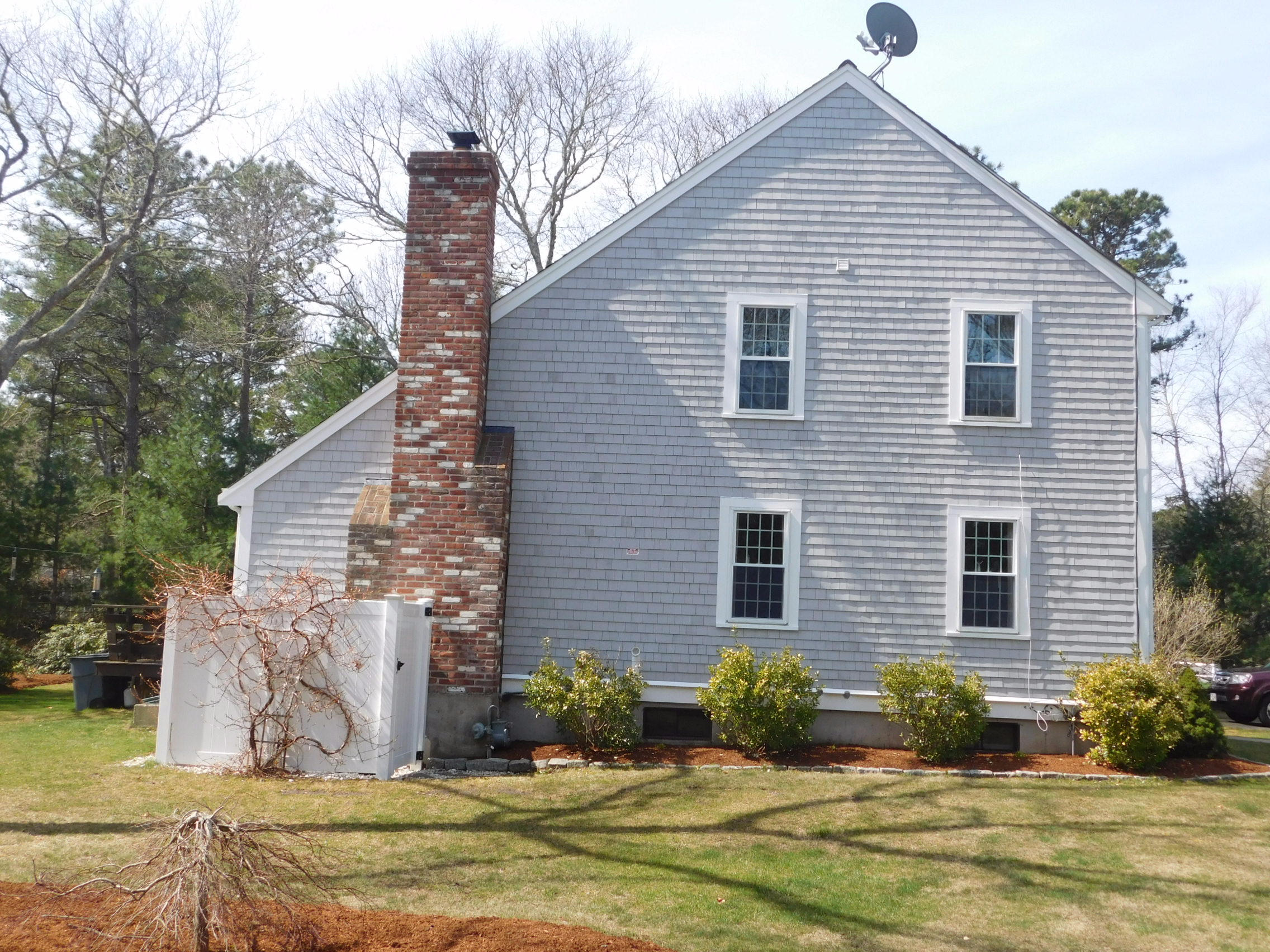 17 Captain Carltons Road Cotuit, MA 02635 - Photo 3 of 26 a front view of a house with garden