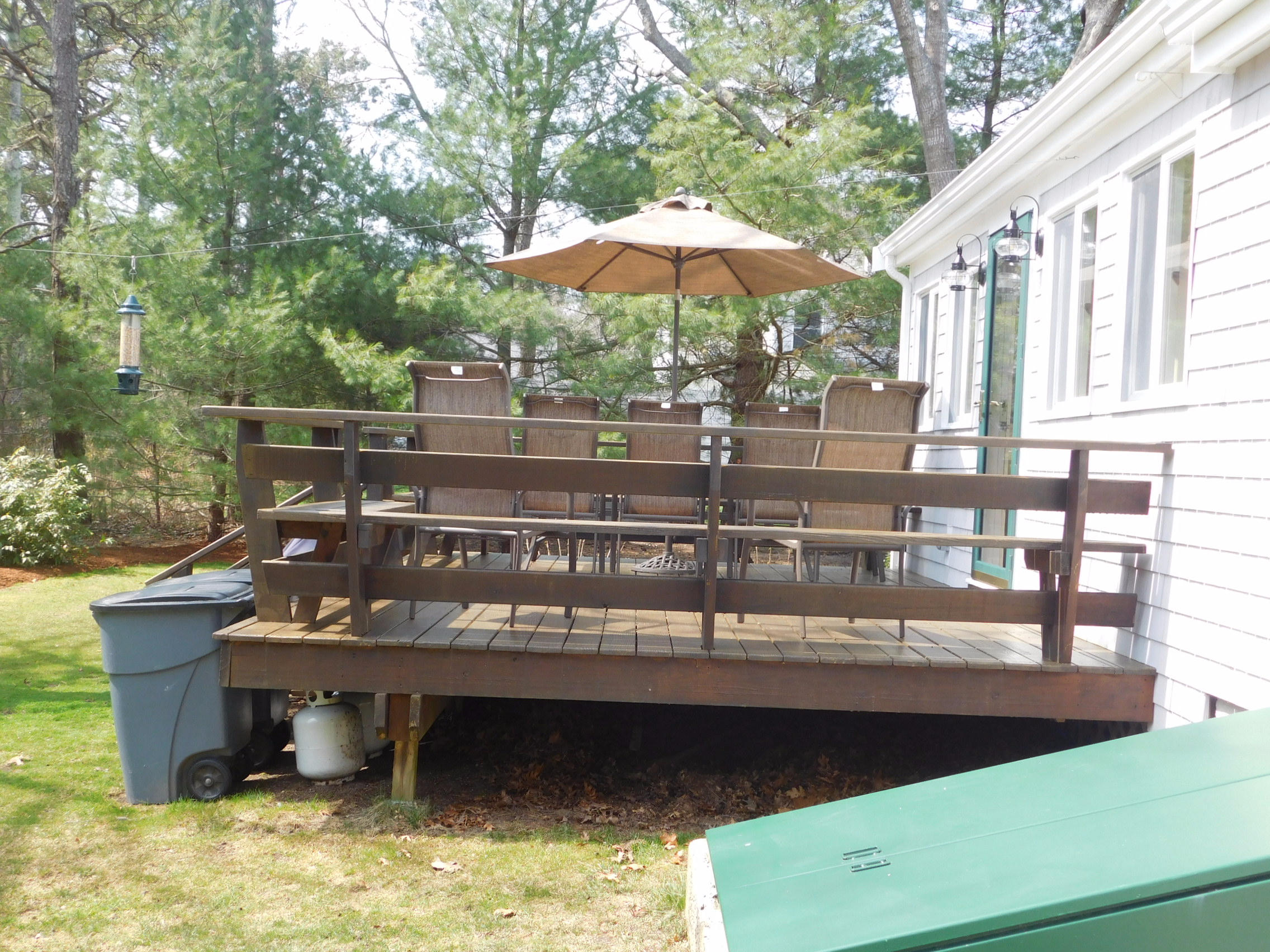 17 Captain Carltons Road Cotuit, MA 02635 - Photo 7 of 26 a view of a balcony with an outdoor seating
