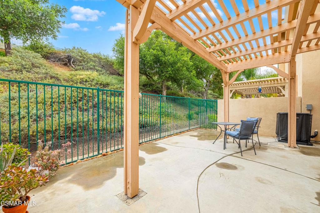 580 Fenwick Way, Unit C Simi Valley, CA 93065 - Photo 16 of 39 a view of a patio with a table chairs and garden