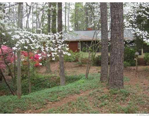 3115 Ridge Road Durham, NC 27705 - Photo 4 of 12 Incredible back porch stretches across most of the back of the house and is accessed from both the Dining Room and the Kitchen. Great place to hang out in all the seasons!