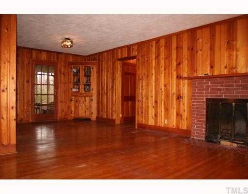 3115 Ridge Road Durham, NC 27705 - Photo 9 of 12 Dining Room is also paneled in quality tongue & groove pine, and has a cool built in corner cupboard. Access to the back porch and the large Kitchen are easy from here.