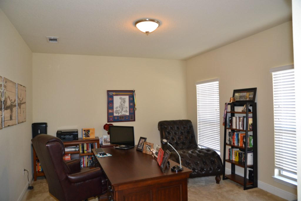 638 Red Fern Road Crestview, FL 32536 - Photo 12 of 55 a view of a workspace with furniture and a window