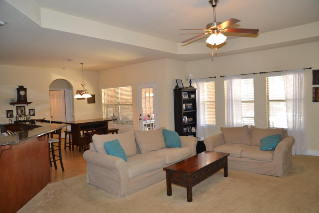 638 Red Fern Road Crestview, FL 32536 - Photo 14 of 55 a living room with furniture kitchen and a chandelier