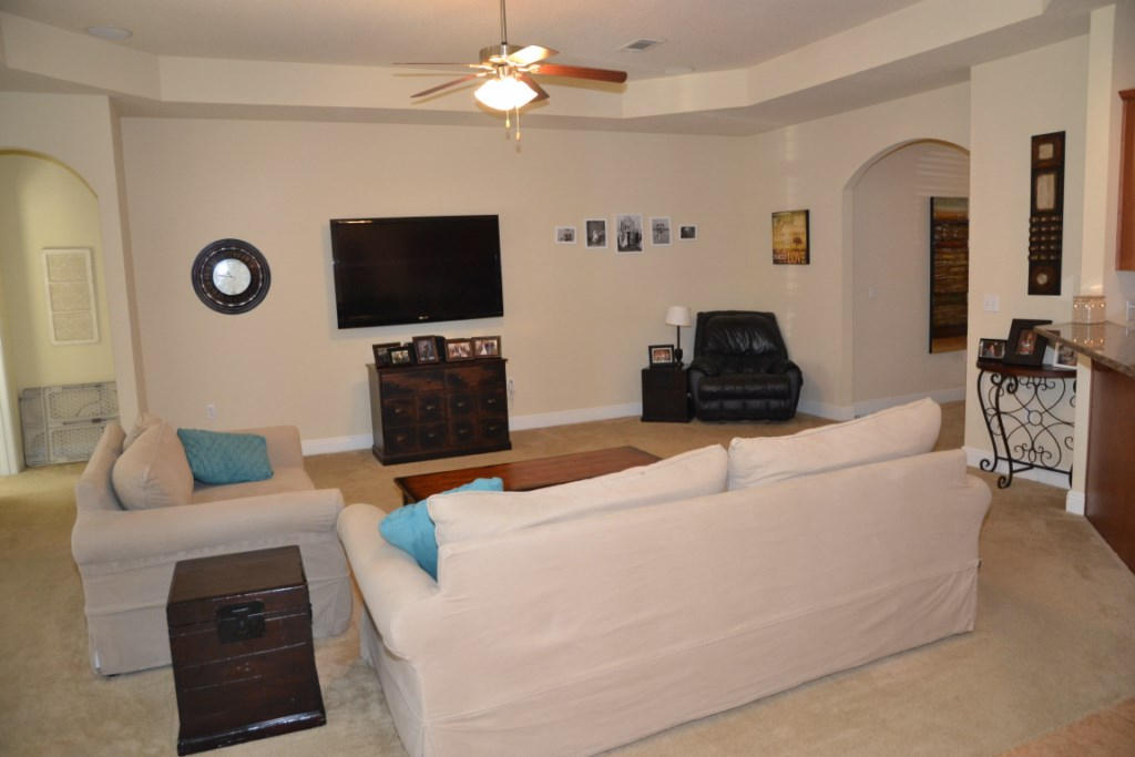 638 Red Fern Road Crestview, FL 32536 - Photo 16 of 55 a living room with furniture and a flat screen tv