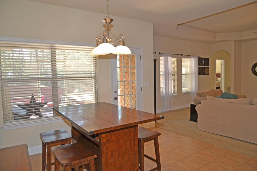 638 Red Fern Road Crestview, FL 32536 - Photo 17 of 55 a view of a dining room with furniture and window