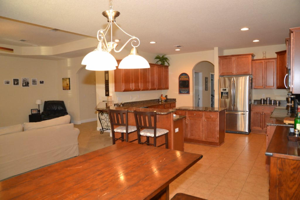 638 Red Fern Road Crestview, FL 32536 - Photo 18 of 55 a living room with lots of furniture and a chandelier