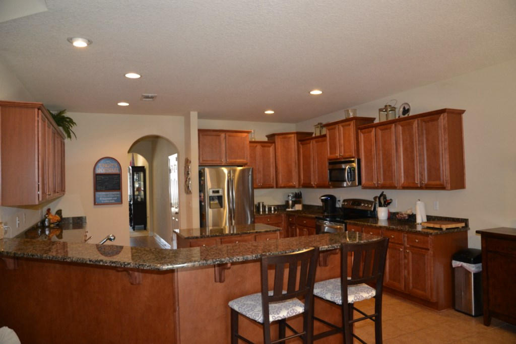 638 Red Fern Road Crestview, FL 32536 - Photo 19 of 55 a kitchen with stainless steel appliances granite countertop a sink and cabinets