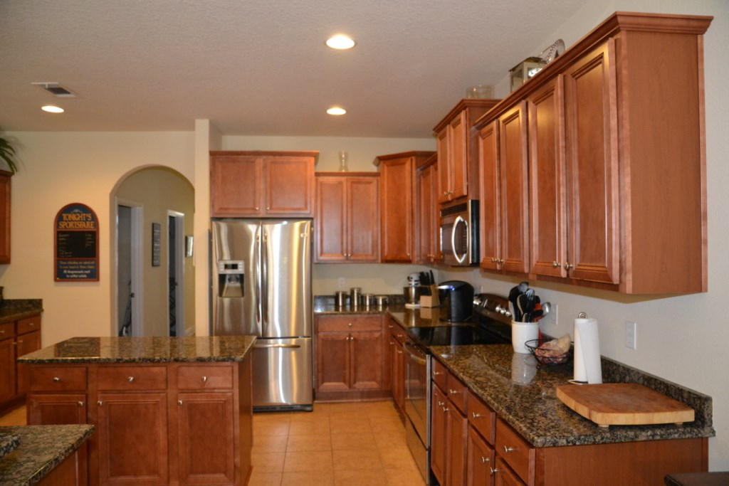638 Red Fern Road Crestview, FL 32536 - Photo 21 of 55 a kitchen with stainless steel appliances granite countertop a refrigerator a stove a sink and dishwasher