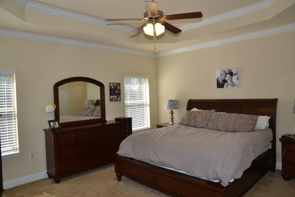 638 Red Fern Road Crestview, FL 32536 - Photo 26 of 55 a bedroom with a bed and a dresser