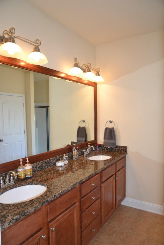 638 Red Fern Road Crestview, FL 32536 - Photo 29 of 55 a bathroom with a granite countertop sink and a mirror