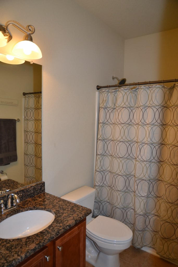 638 Red Fern Road Crestview, FL 32536 - Photo 35 of 55 a bathroom with a granite countertop sink and a mirror