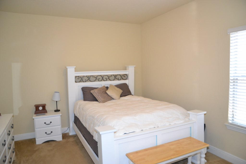 638 Red Fern Road Crestview, FL 32536 - Photo 36 of 55 a bedroom with a bed and a dresser