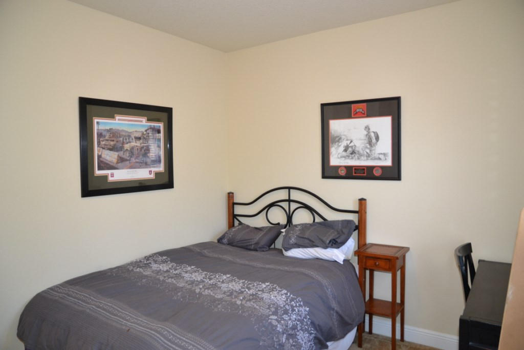 638 Red Fern Road Crestview, FL 32536 - Photo 39 of 55 a bedroom with a bed and a painting on the wall