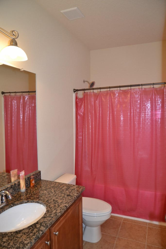 638 Red Fern Road Crestview, FL 32536 - Photo 40 of 55 a bathroom with a granite countertop sink and a mirror
