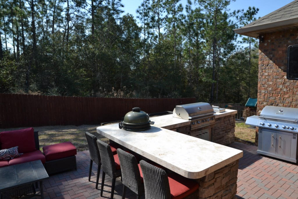 638 Red Fern Road Crestview, FL 32536 - Photo 4 of 55 a view of a tables and chairs in patio