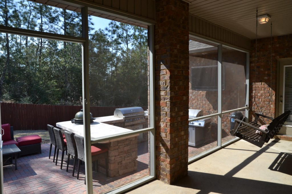 638 Red Fern Road Crestview, FL 32536 - Photo 43 of 55 a view of a balcony dining area with furniture