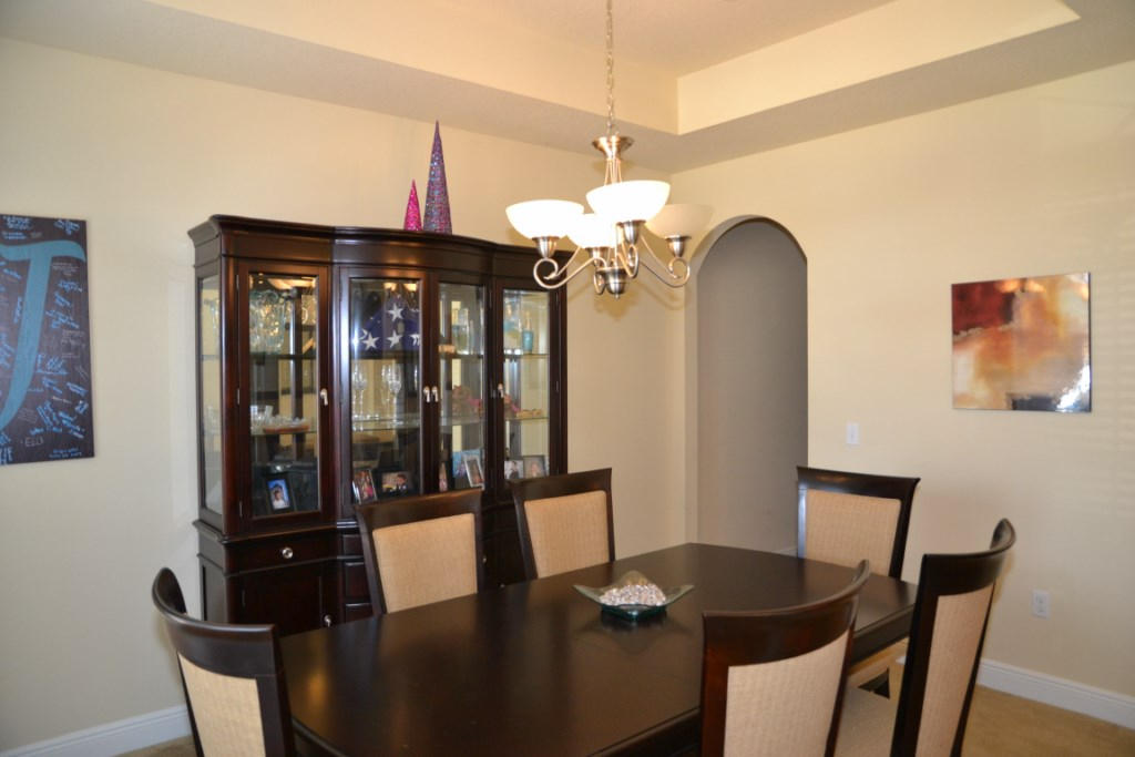 638 Red Fern Road Crestview, FL 32536 - Photo 10 of 55 a view of a dining room with furniture and wooden floor