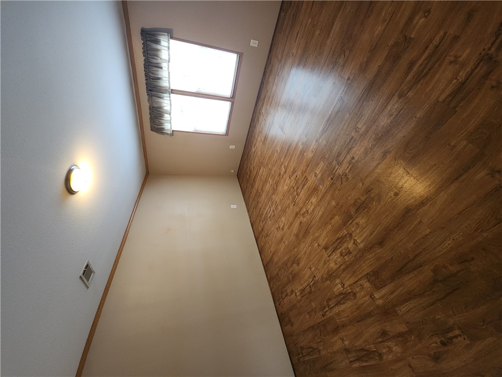 3738 Smetana Road Bryan, TX 77807 - Photo 12 of 29 an empty room with wooden floor and windows