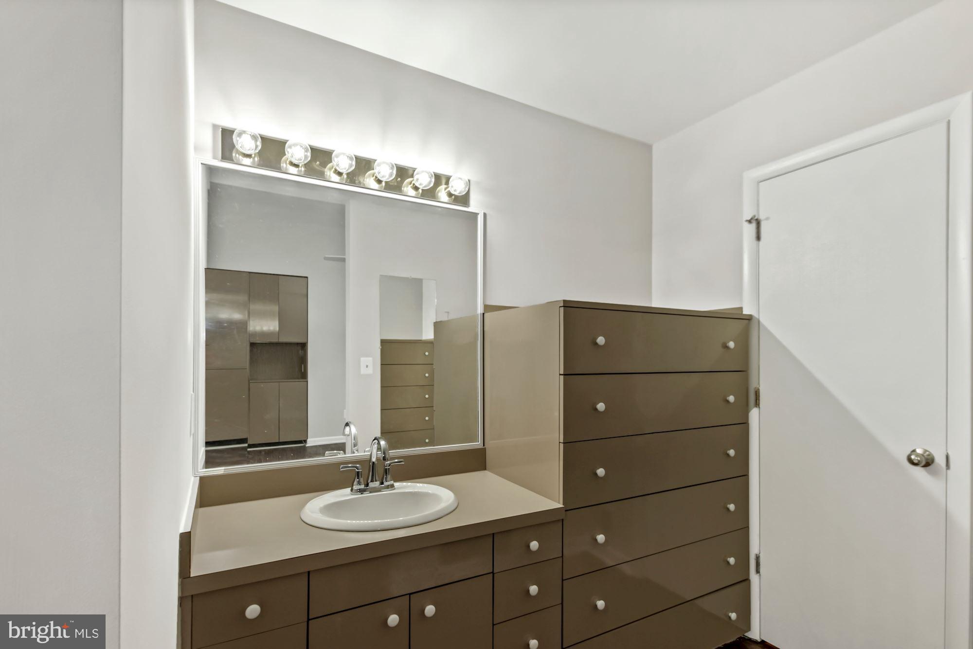 6203 Winston Drive Bethesda, MD 20817 - Photo 16 of 35 Vanity with lots of cabinets